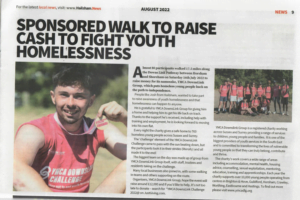 Josh featured in the newspaper, a photo of him smiling holding his medal up alongside the title 'Sponsored walk to raise cash to fight youth homelessness'