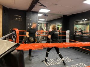 Dee training for boxing with her coach