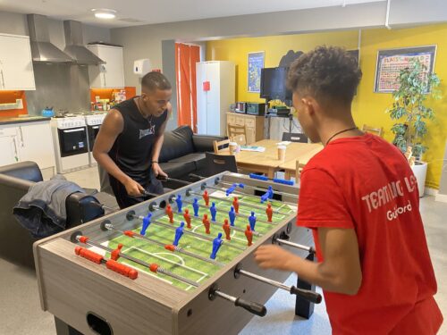 Temesgen and another resident playing table football