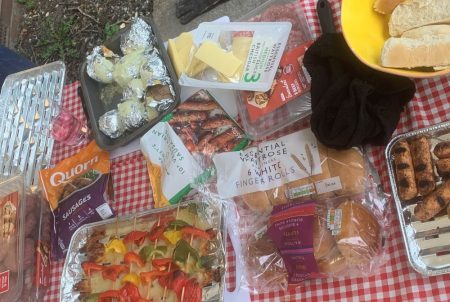 All of the food laid out on the table for the chaplaincy BBQ